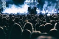 Concert crowd watching rock band performance on the big stage. Royalty Free Stock Photo