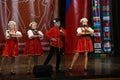 Beautiful girls and a boy sing on stage Royalty Free Stock Photo