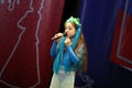 Beautiful girl sings on stage Royalty Free Stock Photo