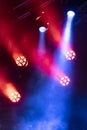 Concert lights, stage, show and excitement. Light spots in concert, outdoor stage at night, foggy electricity.