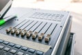 Concert in the Park. Sound mixer control, low angle shot with shallow depth field. Royalty Free Stock Photo