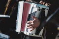 Concert view of accordion player performing on a stage with vocalist and jazz group band orchestra in the background, accordionist Royalty Free Stock Photo