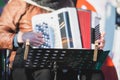 Concert view of accordion player performing on a stage with vocalist and jazz group band orchestra in the background, accordionist Royalty Free Stock Photo