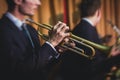 Concert view of a male trumpeter, professional trumpet player with vocalist and musical during jazz band performing music