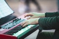 Concert view of a musical keyboard piano player during musical jazz band orchestra performing, keyboardist hands during concert, Royalty Free Stock Photo