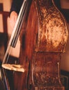 Concert view of an old retro vintage contrabass violoncello  player with vocalist and musical band during jazz orchestra band Royalty Free Stock Photo