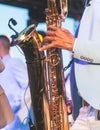 Concert view of saxophonist in a blue and white suit, a saxophone sax player with vocalist and musical band during jazz orchestra Royalty Free Stock Photo