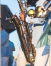 Concert view of saxophonist in a blue and white suit, a saxophone sax player with vocalist and musical band during jazz orchestra Royalty Free Stock Photo