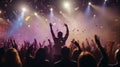 Concertgoers with confetti and vivid stage lights Royalty Free Stock Photo