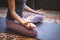 Concet Meditation. Woman Sitting in Lotus Pose. Yoga Female Practicing Yoga Meditation Exercise on the Mat in her Living