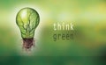 Renewable energy concept - Eco light bulb with text -think green-