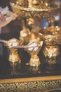 Conch shell in gold decoration. Conch shell us used to pour blessed water during the wedding ceremony. Vintage filter
