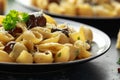 Conchiglie pasta with mushrooms, creamy sauce, parmesan cheese and herbs Royalty Free Stock Photo