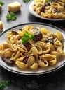 Conchiglie pasta with mushrooms, creamy sauce, parmesan cheese and herbs Royalty Free Stock Photo