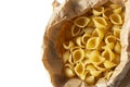 Conchiglie pasta shells in a brown paper bag. Eco-friendly recycling packaging Royalty Free Stock Photo