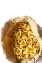 Conchiglie pasta shells in a brown paper bag. Eco-friendly recycling packaging Royalty Free Stock Photo