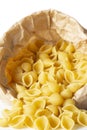 Conchiglie pasta shells in a brown paper bag. Eco-friendly recycling packaging Royalty Free Stock Photo