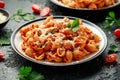 Conchiglie rigate pasta with chickpeas in tomato sauce with parmesan cheese. Healthy vegan food. Royalty Free Stock Photo
