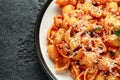 Conchiglie rigate pasta with chickpeas in tomato sauce with parmesan cheese. Healthy vegan food. Royalty Free Stock Photo