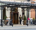 The concierge in traditional dress and top hat at the entrance to the Shelbourne Hotel in St Stephen`s Green, Dublin