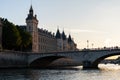 The conciergerie and the bridge Pont au Change seen from the seine river in Paris France at sunset Royalty Free Stock Photo