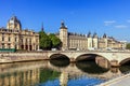 Conciergerie Castle and Bridge of Change over river Seine. Paris, France Royalty Free Stock Photo