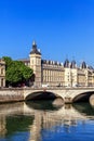 Conciergerie Castle and Bridge of Change over river Seine. Paris, France Royalty Free Stock Photo