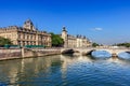 Conciergerie Castle and Bridge of Change over river Seine. Paris, France Royalty Free Stock Photo