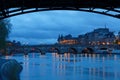 Conciergerie and Pont Neuf bridge over river Seine at night, Paris, France Royalty Free Stock Photo