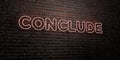 CONCLUDE -Realistic Neon Sign on Brick Wall background - 3D rendered royalty free stock image