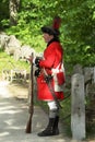 A man in uniform of a British soldier of Revolutionary War in Minute Man National Historical Park Royalty Free Stock Photo