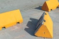 Concrete anti-terrorism barriers on a sidewalk.