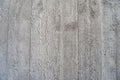 Concrete background, grey unplastered conrete material on wall. Unrendered concrete with wooden pressure print Royalty Free Stock Photo