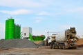 Concrete batching plant. Industrial producing concrete for construction. Heavy mixer concrete trucks Royalty Free Stock Photo