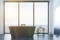 Concrete bathroom, gray tub and window toned Royalty Free Stock Photo