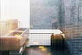 Concrete bathroom, tiled tub and sink toned Royalty Free Stock Photo