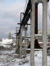 Concrete beams supporting pipeline at the timber processing factory Royalty Free Stock Photo