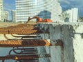 Concrete block with rusty rebar sticking out inside. fasteners for the construction of concrete high houses. blocks on the