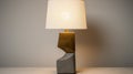 Concrete And Brass Table Lamp With Light Brown Shade Royalty Free Stock Photo