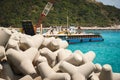 Concrete breakwaters and cargo ship Royalty Free Stock Photo