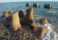 Concrete breakwaters on the seashore.