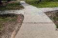 Concrete and brick paths intersect and go off in 4 directions, choice choices metaphor, creative copy space, horizontal aspect Royalty Free Stock Photo