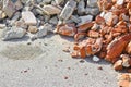 Concrete and brick rubble debris on construction site after a demolition of a brick building