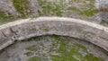 Concrete ceiling of an arch of architecture, covered with moss or mold.