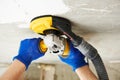 Concrete ceiling surface grinding by angle grinder machine Royalty Free Stock Photo