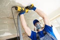 Concrete ceiling surface grinding by angle grinder machine Royalty Free Stock Photo