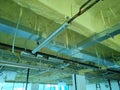 A concrete ceiling surface that has been sprayed with a layer of polyurethane foam.