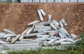 Concrete cement pillars fell on the ground slopes