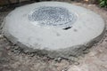Concrete cesspool, septic tank with plastic manhole cover Royalty Free Stock Photo
