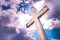 Concrete christian cross against a dramatic cloudy sky - concept Royalty Free Stock Photo